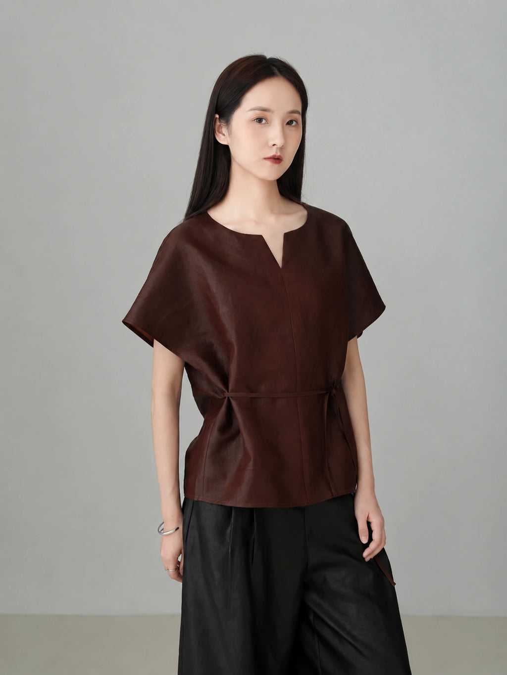 Women wearing a red Xiangyunsha silk top featuring modern oriental style, breathable natural silk fabric, and minimalist luxury design.