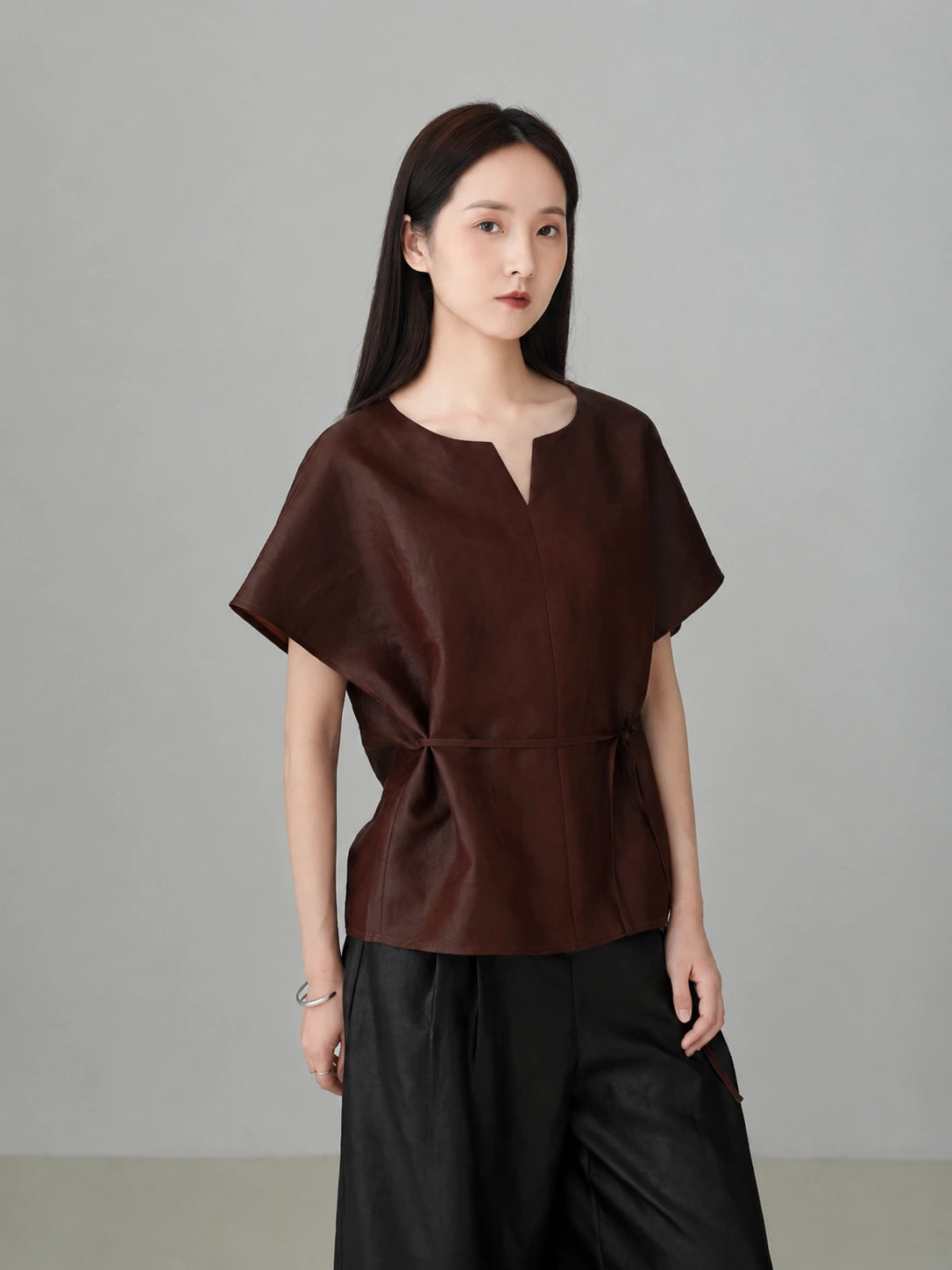 Women wearing a red Xiangyunsha silk top featuring modern oriental style, breathable natural silk fabric, and minimalist luxury design.