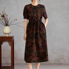Front view of the vintage floral side of a reversible Xiangyunsha silk dress with short sleeves and a waist tie