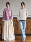 Side-by-side views of a reversible floral jacquard jacket, shown in purple with an ivory skirt and in ivory with blue jeans.