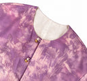 Close-up of the round neckline showing the purple outer side and ivory reverse.