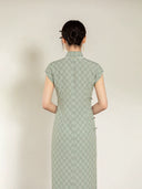Full back view of the sage green jacquard cheongsam dress with Mandarin collar.