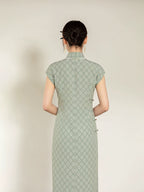 Full back view of the sage green jacquard cheongsam dress with Mandarin collar.