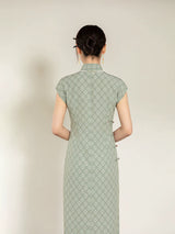 Full back view of the sage green jacquard cheongsam dress with Mandarin collar.