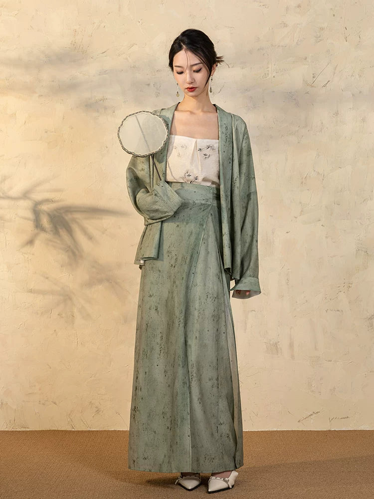 Full-length look of the Sage Green Draped Sleeve Jacket and Wrap Skirt Set.