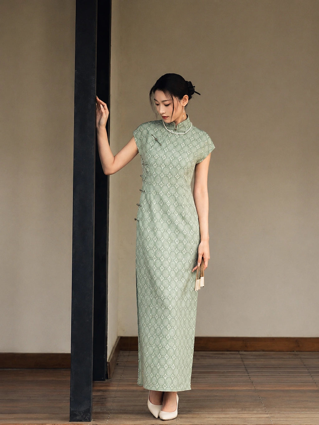 Sage green jacquard cheongsam dress with Mandarin collar full front view.