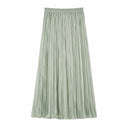 Flat lay of a sage green pleated maxi skirt with an elastic waistband and full length, crafted from 80% Lyocell, 20% Polyester.