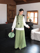Full-body view of a 100% mulberry silk Chinese vest with rabbit artwork, styled with a matching sage green pleated skirt.
