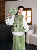 Front view of a sage green Chinese-style silk vest with a stand collar and artistic rabbit pattern.