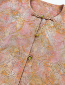 Close-up of the decorative front buttons and multicolored jacquard
