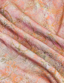 Close-up of the peach, muted gold and olive vintage-inspired jacquard fabric