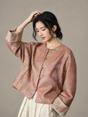 Angled view of the model wearing the jacket with a cuff turned back
