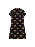 Front product view of the black mulberry silk Song brocade dress with woven gold butterflies