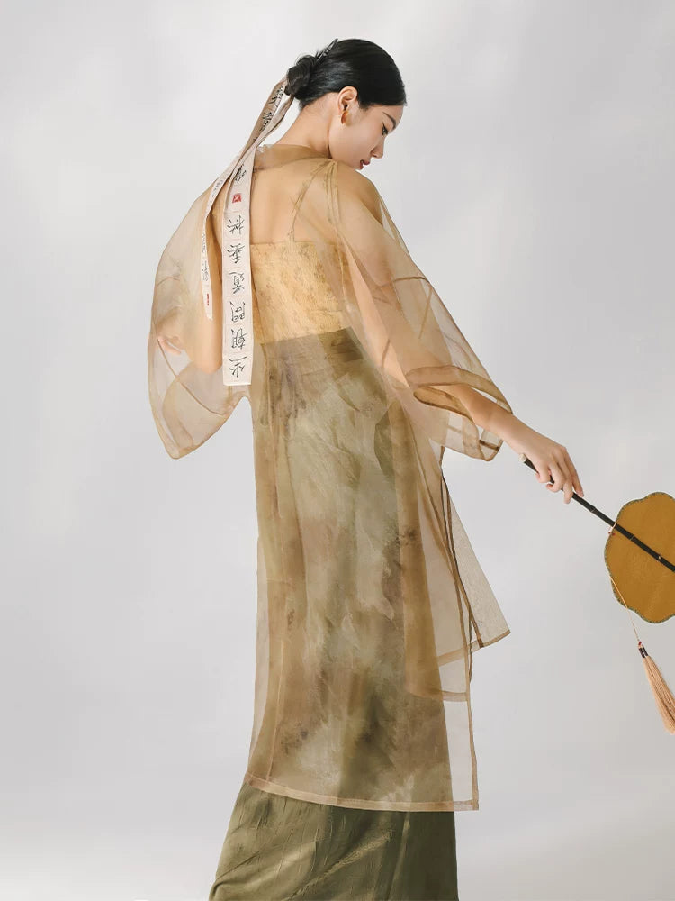 Back view of a flowing sheer organza long cover-up.