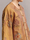 Close-up of floral embroidery, round-neck trim and sleeve details on the antique gold silk jacket