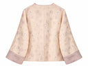 Back view of the pale blush jacquard jacket with contrasting lilac cuffs
