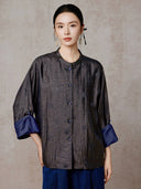 Model wearing the buttoned Xiangyunsha silk jacket with blue cuffs