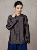 Model wearing the jacquard silk jacket with one sleeve worn down