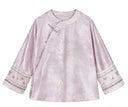 Front product view of the smoky pink jacquard jacket with an asymmetric opening and embroidered cuffs.