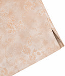 Close-up of the jacket’s peach-pink floral fabric pattern and side hem detail.