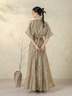 Back view of the Stone Beige Open Front Jacket with self-tie styling.