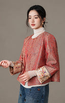 Angled view of the model wearing the jacket over a cream top