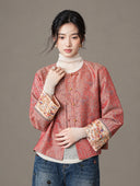Front view of the model wearing the jacket with denim, showing both embroidered cuffs