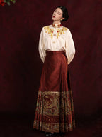 Traditional Chinese-inspired embroidered blouse and pleated skirt outfit for cultural occasions.