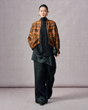 Open-front styling of the vintage brown mulberry silk jacket layered over a black tunic and trousers