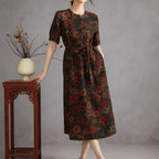 Woman wearing the floral side of a reversible Xiangyunsha silk midi dress with an A-line silhouette