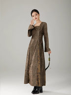 Women's elegant vintage maxi dress featuring a square neckline and softly flared sleeves.