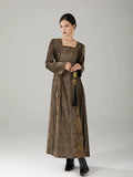 Three-quarter view of a women's textured vintage maxi dress with graceful drape.