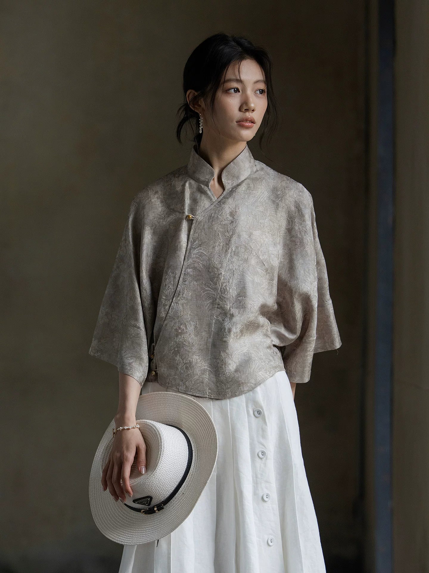Relaxed fit Warm Mist jacquard blouse styled with a white button-front skirt.