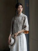 Side view of a Warm Mist Mandarin collar jacquard blouse in natural light.