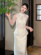Woman wearing a white sleeveless Cheongsam top and matching skirt with floral embroidery, holding bamboo leaves, featuring a mandarin collar.