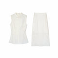 Flat lay of a white New Chinese style two-piece set, featuring a sleeveless top with a mandarin collar and a matching midi skirt.