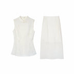 Flat lay of a white New Chinese style two-piece set, featuring a sleeveless top with a mandarin collar and a matching midi skirt.