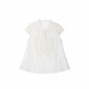Flat lay of a white lace-trimmed Cheongsam top with a mandarin collar, delicate floral embroidery, and short lace sleeves, crafted from 80% Viscose, 20% Polyamide.