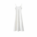 Flat lay of a white satin slip dress with silver-toned strap hardware and a minimalist design, crafted from 100% polyester.