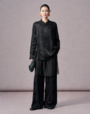 Front view of a women’s black jacquard two-piece set with a Mandarin collar shirt and full-length pants