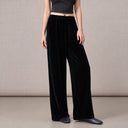 Front view of women’s dark coffee brown silk velvet pants with flowing wide legs