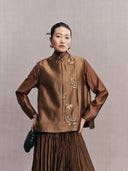 Front view of a bronze brown New Chinese vest with a stand collar and embellished butterflies
