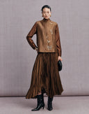 Woman wearing the bronze brown butterfly vest with a matching brown skirt
