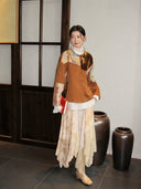 Brown Shu brocade patchwork jacket styled with a white blouse and cream skirt
