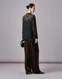 Side and back view of dark brown velvet wide-leg pants with a relaxed drape