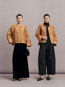 Two ways to style the antique gold embroidered silk jacket with a black skirt or wide-leg trousers