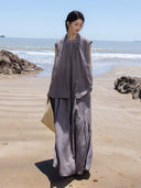 Full-length view of a women’s summer two-piece set with a sleeveless top and long asymmetric skirt.