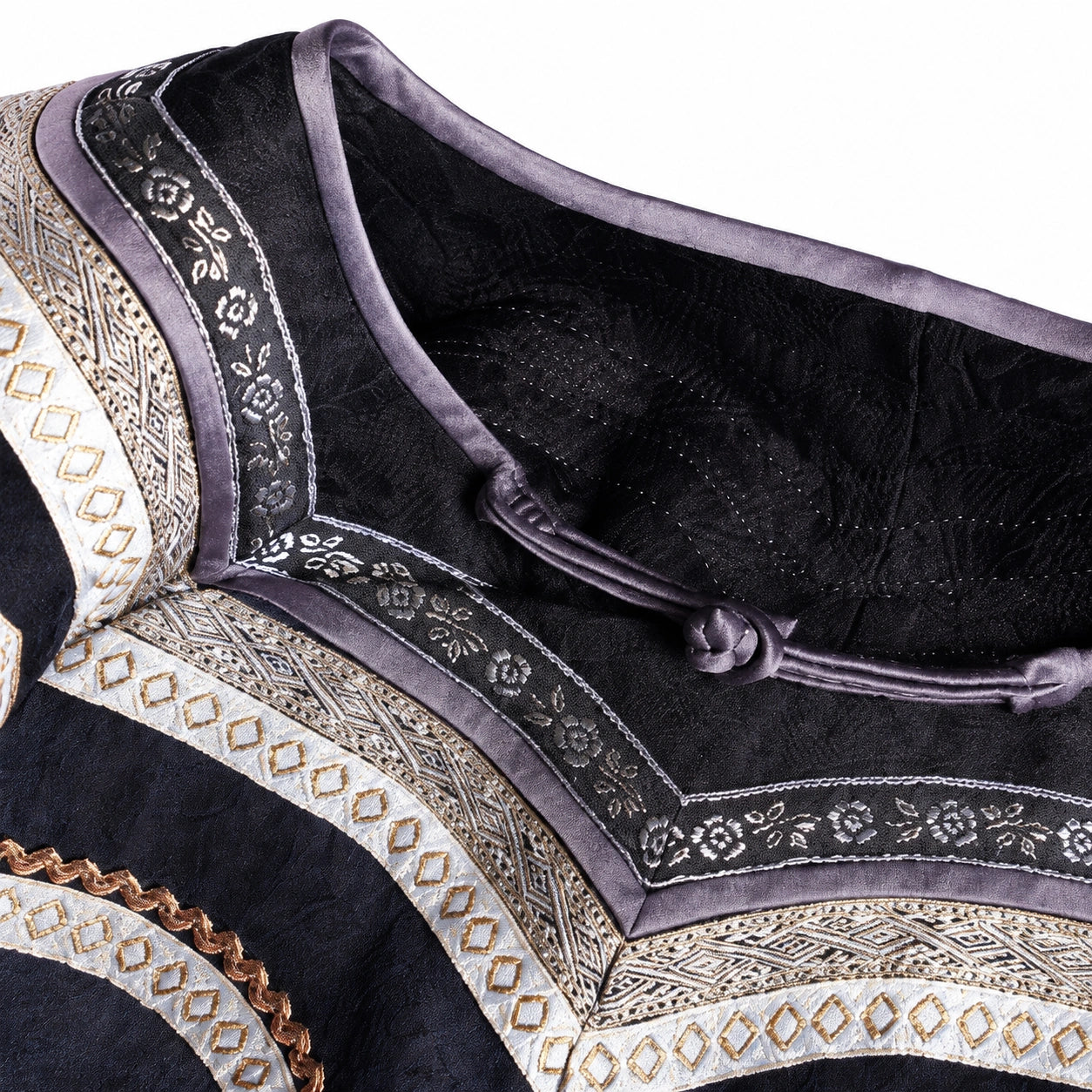 Close-up of the decorative neckline trim and handmade frog-button closure on the Xiangyunsha silk dress