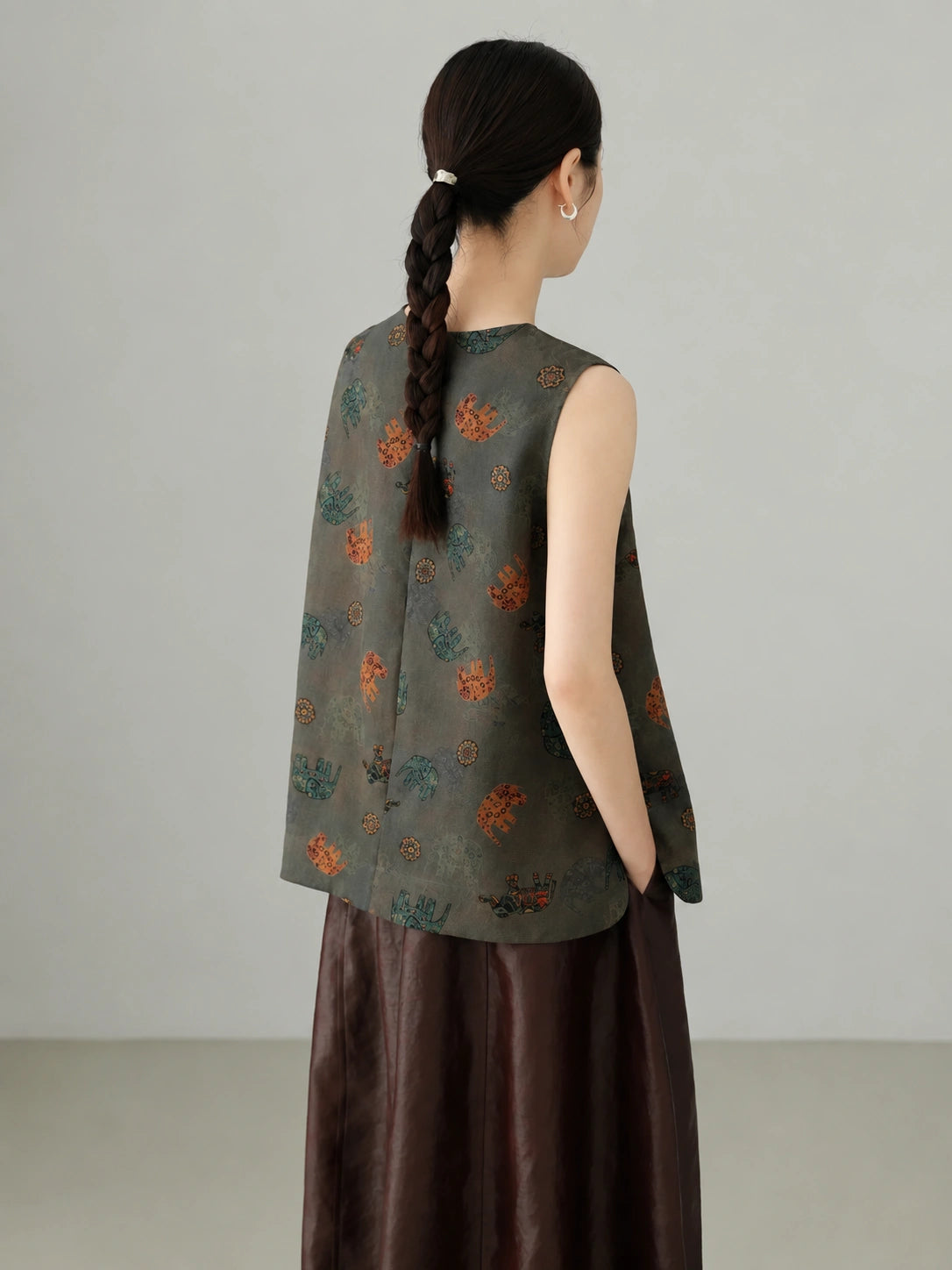 Back view of grey Xiangyunsha mulberry silk sleeveless vest showcasing elegant drape and traditional textile craftsmanship
