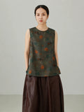 Close-up view of Xiangyunsha mulberry silk vest top featuring traditional elephant pattern print and premium silk texture
